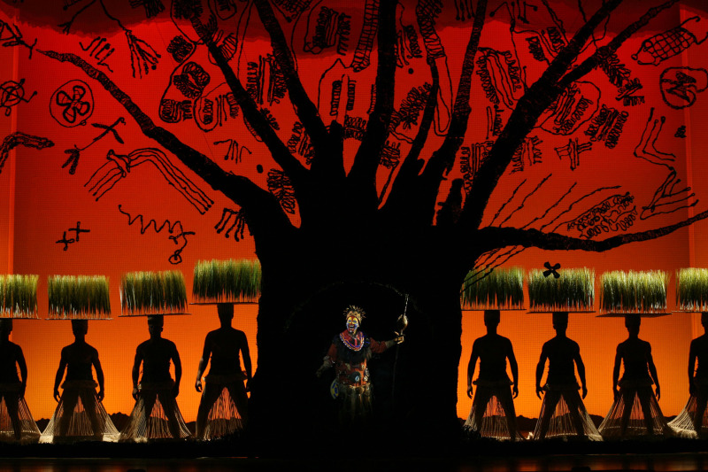 Tshidi Manye as Rafiki and Ensemble in THE LION KING on Broadway. Photo Credit: Joan Marcus ©Disney